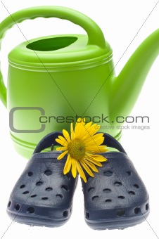 Garden Concept with Clogs and Watering Can