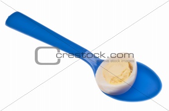 Sliced Hard Boiled Quail Egg on a Spoon
