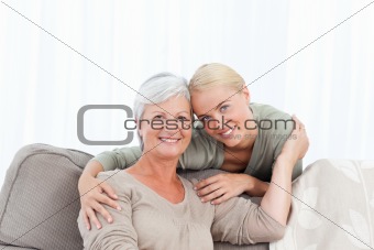 Wonderful nurse and her mature patient looking at the camera