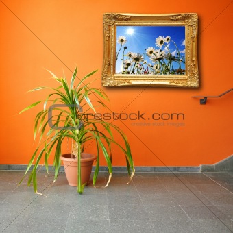picture on a wall and plant