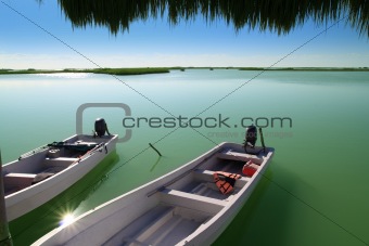 boats in pier mangrove lagoon in Mayan Riviera