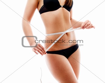 Woman measuring her torso
