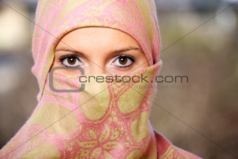 Muslim woman hidden behind a scarf