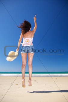 happy woman jumping at Zahara beach