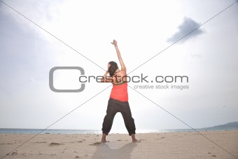 woman touching sun at Tarifa beach
