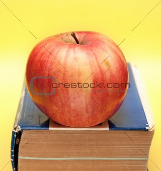 old book with apple on it