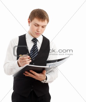 Man writing something in a folder.