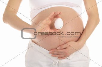 pregnant woman holding an egg