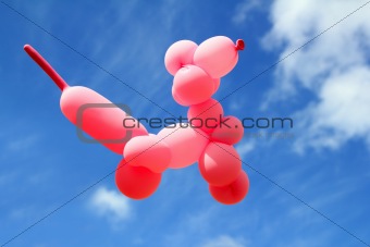 balloon with poodle dog caniche shape fly blue sky