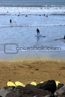 surfers on a beautiful beach