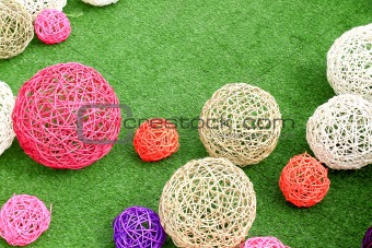 color rattan ball on green grass.
