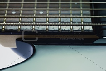 detail of electric bass cords and frets