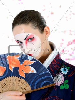  japan geisha woman with creative make-up with fan