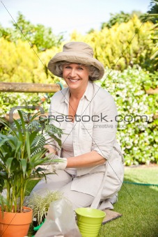 Smiling woman in her garden 
