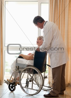 Doctor with his patient looking out the window