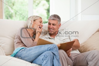 Couple looking at their photo album