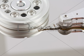 Platters and head of a computer hard drive 