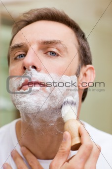 Man shaving in the bathroom