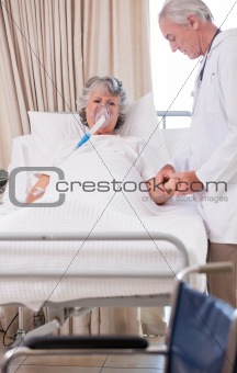 Senior doctor with his sick patient