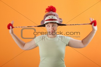 Woman Plays with Her Cap