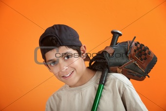 Young boy with baseball glove and bat