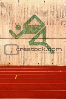 running track and a logo on the wall 