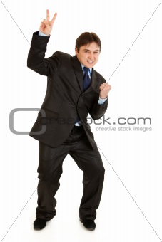 Happy modern businessman showing victory gesture
