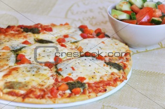 Appetizing pizza with mozzarella cheese and salad 