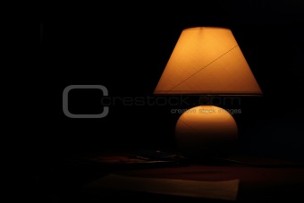 Ancient lamp on table in the dark