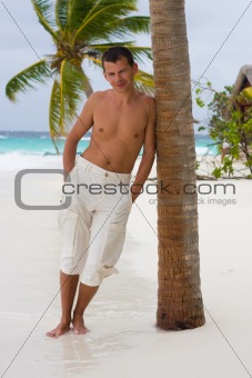 Young man on a tropical beach