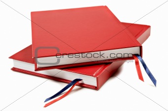 Red notebook on a pure white background