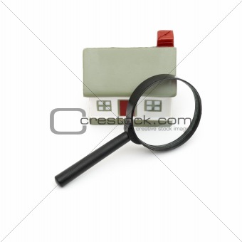 magnifying glass examining model home