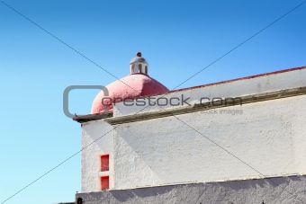 mexican white house with red dome