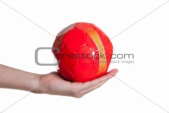 man holding red small football ball