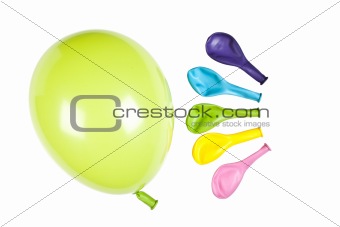 One inflated balloon with colorful balloons