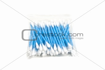 Cotton sticks on blue background