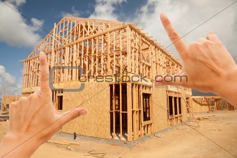 Female Hands Framing New Home Frame on Construction Site.
