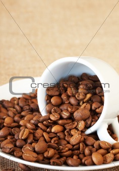 Cup filled with coffee beans