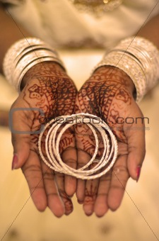 Indian wedding bride getting henna applied 