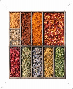 Wooden box with different herbs and spices - pepper, paprika, cu
