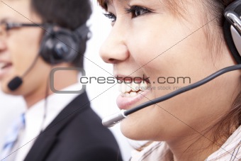 customer support team with  smiling businesswoman in an office