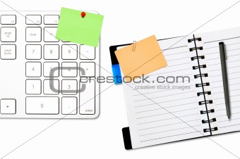 open notepad and colored memo with keyboard