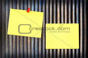 yellow note and wood background