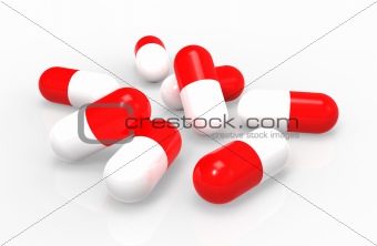 Red medical capsules isolated on white background, close-up.