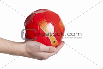 small soccer red ball in hand. Isolated on white