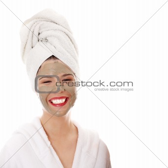 Cosmetics mask of clay on the beautiful young woman face