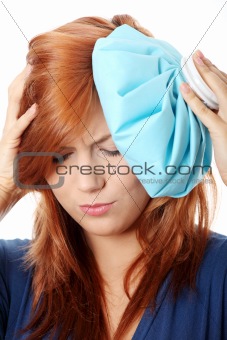 Woman with ice bag for headaches