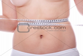 Female measuring her body