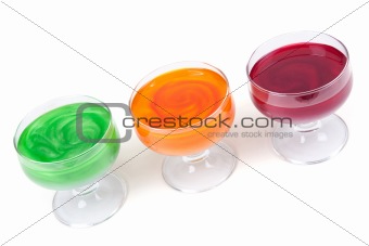 Green, yellow and red jelly in glass