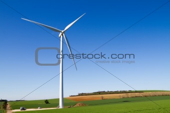 Wind turbine under clear blue sky